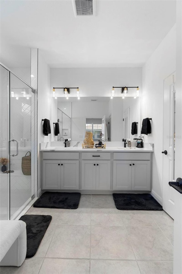 4911 Shady Pines Dr, Saint Cloud, FL 34772 - full bathroom with double vanity, a stall shower, and tile patterned flooring