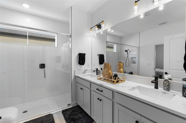 4911 Shady Pines Dr, Saint Cloud, FL 34772 - bathroom featuring connected bathroom, plenty of natural light, double vanity, and a stall shower
