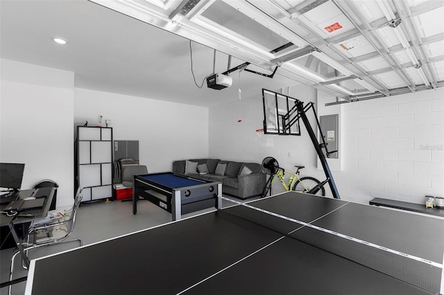 4911 Shady Pines Dr, Saint Cloud, FL 34772 - playroom with concrete block wall, concrete floors, and electric panel