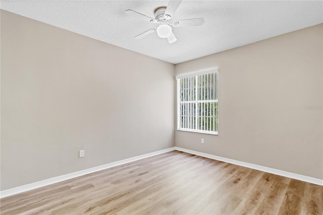 2007 Royal Bay Blvd Unit 144, Kissimmee, FL 34746 - empty room featuring baseboards, light wood-style floors, ceiling fan, and a textured ceiling