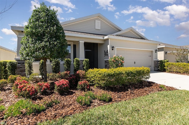 view of front of house with concrete driveway and a garage