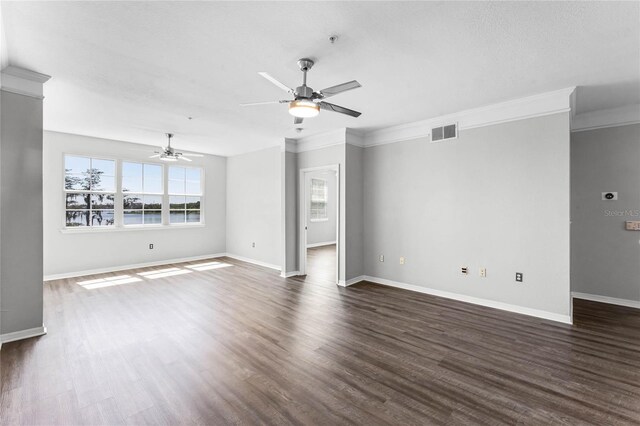 3384 Corona Village Way Unit 202, Orlando, FL 32835 - unfurnished living room with ornamental molding, baseboards, dark wood-style floors, ceiling fan, and visible vents