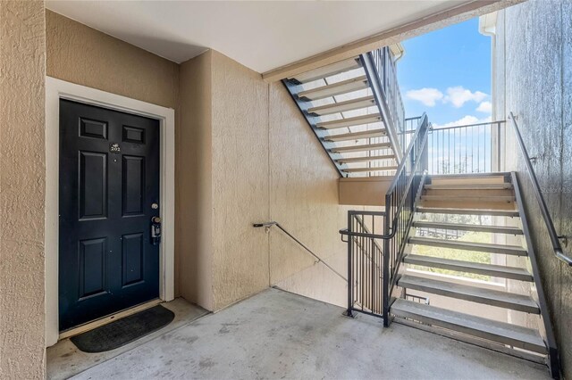 3384 Corona Village Way Unit 202, Orlando, FL 32835 - property entrance featuring stucco siding