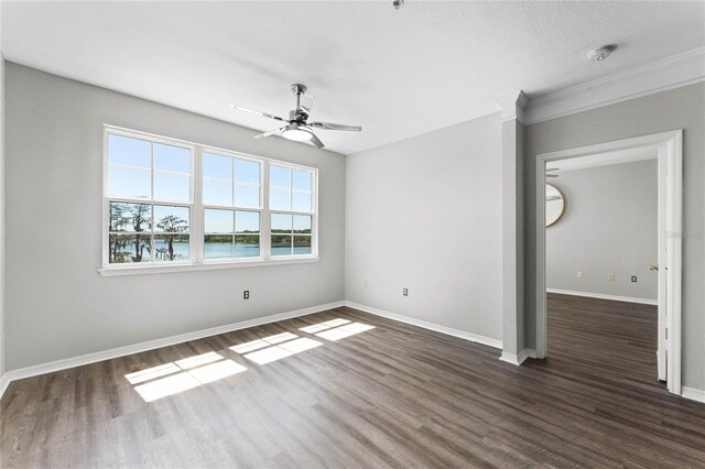 3384 Corona Village Way Unit 202, Orlando, FL 32835 - unfurnished room with dark wood-type flooring, baseboards, and ceiling fan