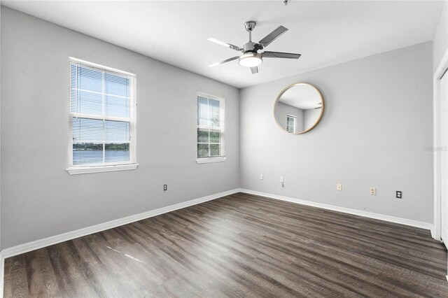 3384 Corona Village Way Unit 202, Orlando, FL 32835 - empty room featuring baseboards, dark wood-style flooring, and ceiling fan
