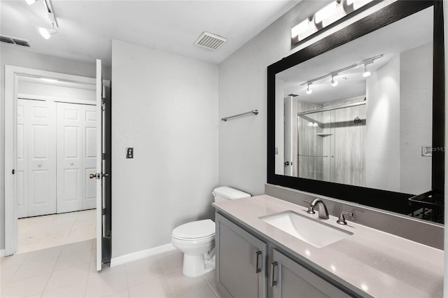 3384 Corona Village Way Unit 202, Orlando, FL 32835 - bathroom featuring a shower with shower door, visible vents, tile patterned floors, and vanity