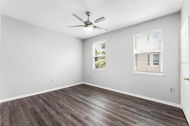 3384 Corona Village Way Unit 202, Orlando, FL 32835 - spare room featuring dark wood-type flooring, baseboards, and ceiling fan