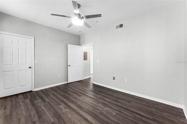 3384 Corona Village Way Unit 202, Orlando, FL 32835 - unfurnished bedroom with electric panel, dark wood-style floors, baseboards, visible vents, and ceiling fan