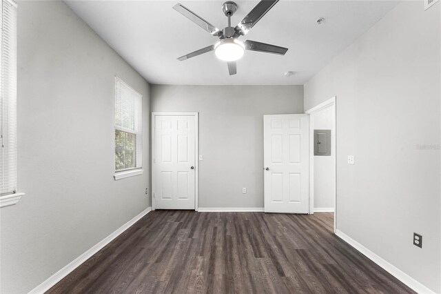 3384 Corona Village Way Unit 202, Orlando, FL 32835 - unfurnished bedroom featuring baseboards, ceiling fan, wood finished floors, and electric panel