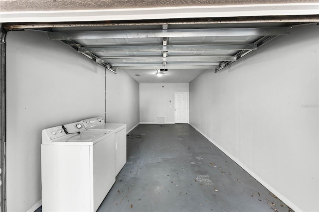 3384 Corona Village Way Unit 202, Orlando, FL 32835 - garage with baseboards and washing machine and dryer