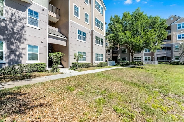 3384 Corona Village Way Unit 202, Orlando, FL 32835 - view of community featuring a residential view and a lawn