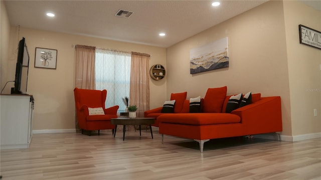 345 W Seminole Ave, Eustis, FL 32726 - sitting room with wood finished floors, baseboards, and recessed lighting