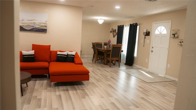 345 W Seminole Ave, Eustis, FL 32726 - entryway with light wood finished floors, baseboards, and recessed lighting