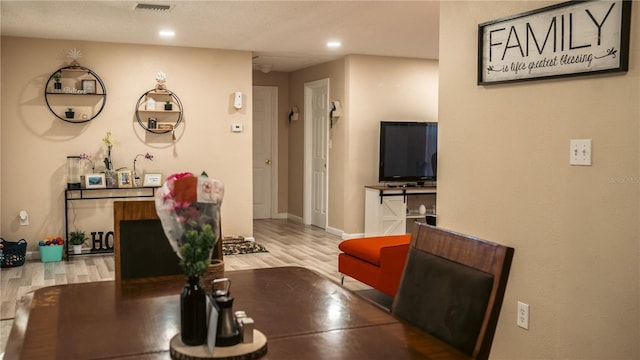 345 W Seminole Ave, Eustis, FL 32726 - dining room with wood finished floors, recessed lighting, and baseboards