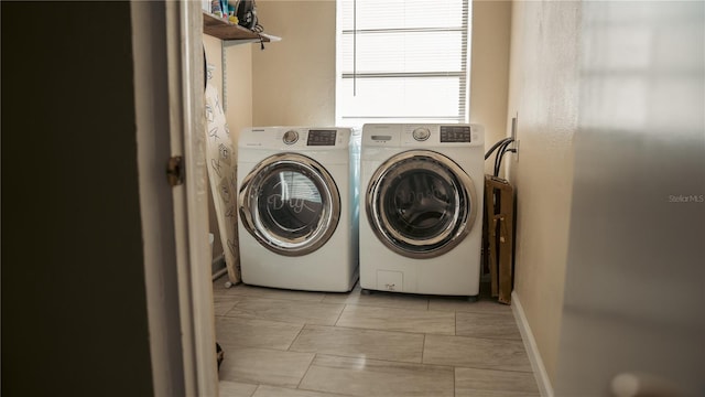 345 W Seminole Ave, Eustis, FL 32726 - clothes washing area with washing machine and dryer, light marble finish flooring, and baseboards