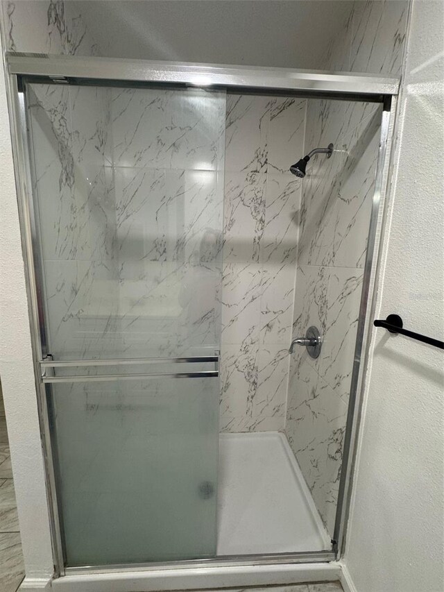 345 W Seminole Ave, Eustis, FL 32726 - full bath featuring a marble finish shower