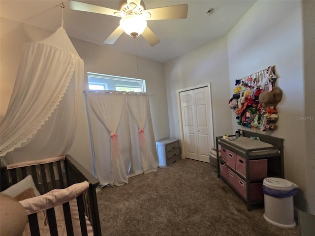 bedroom featuring a closet, dark carpet, and a ceiling fan