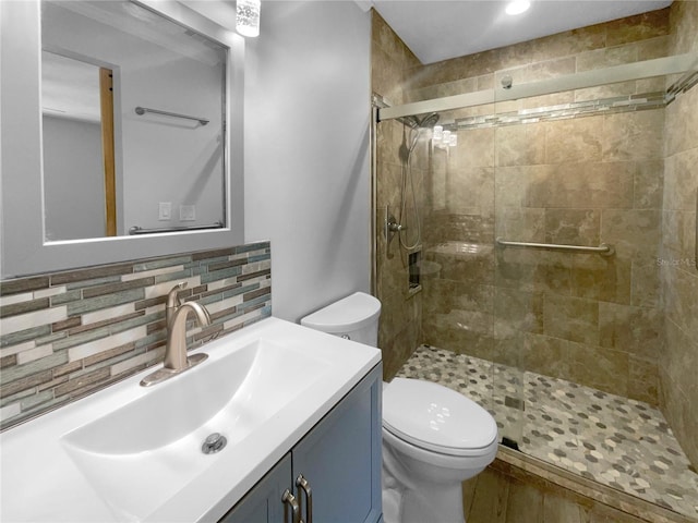 6 Almond Trce, Ocala, FL 34472 - bathroom featuring tasteful backsplash, a stall shower, vanity, and toilet
