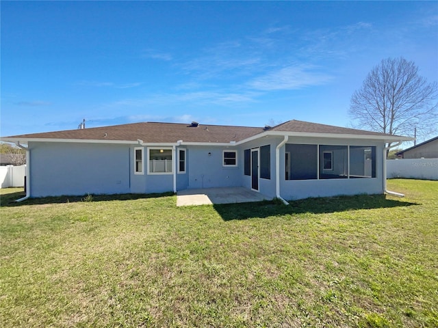 6 Almond Trce, Ocala, FL 34472 - back of house with a yard, a sunroom, stucco siding, and fence
