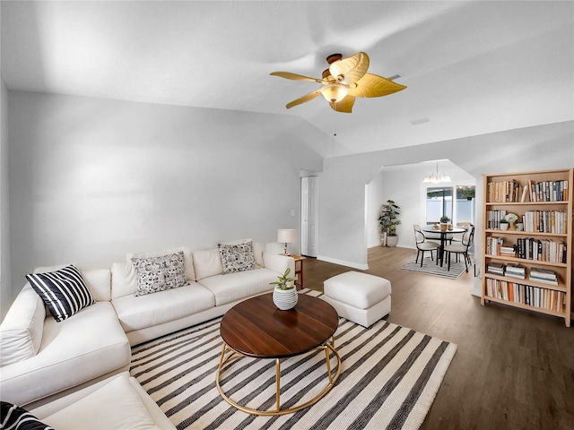 6 Almond Trce, Ocala, FL 34472 - living area featuring ceiling fan with notable chandelier, baseboards, lofted ceiling, and wood finished floors