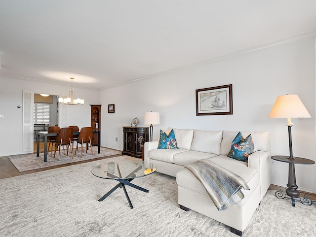 living room featuring a chandelier, crown molding, and baseboards