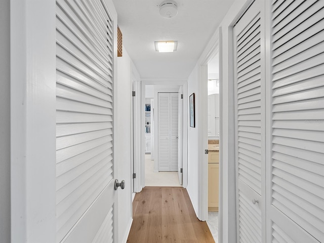 hallway featuring light wood-style floors