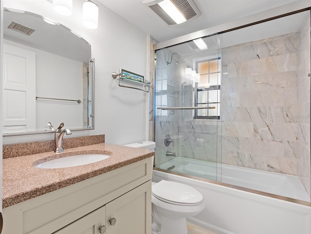 full bathroom with toilet, vanity, combined bath / shower with glass door, and visible vents
