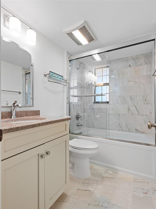 bathroom featuring vanity, visible vents, toilet, marble finish floor, and bath / shower combo with glass door