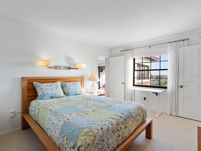 bedroom with carpet flooring, baseboards, and ornamental molding