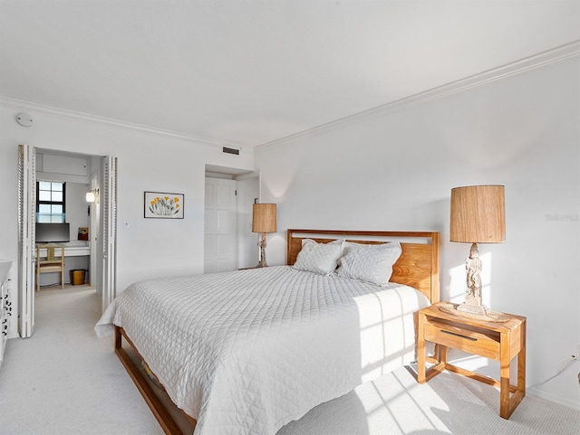 bedroom featuring light carpet, visible vents, and crown molding