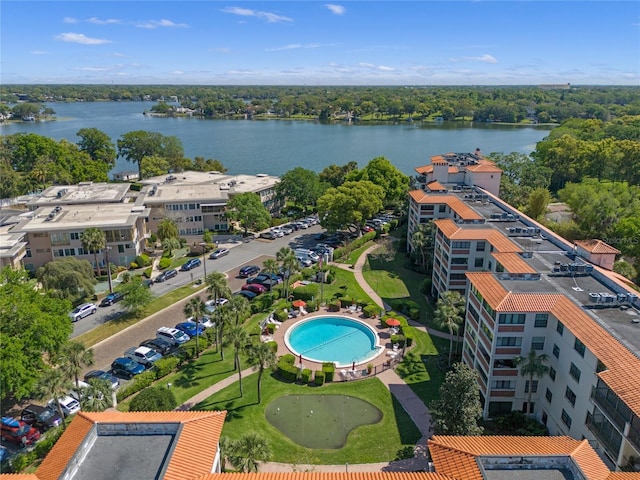 birds eye view of property with a water view
