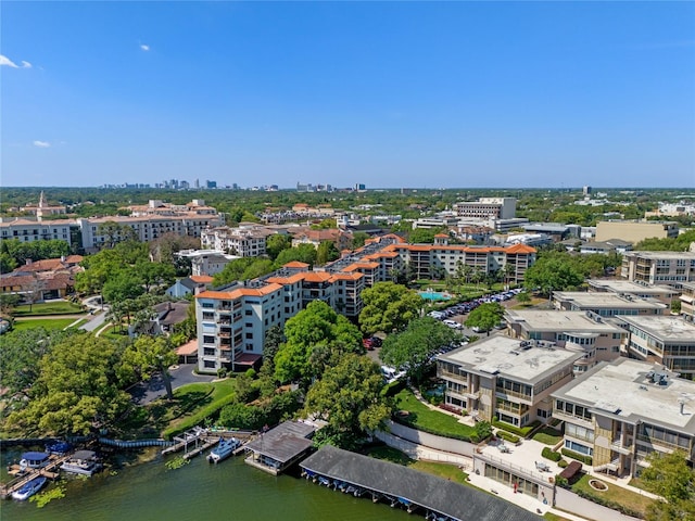 drone / aerial view featuring a water view and a view of city