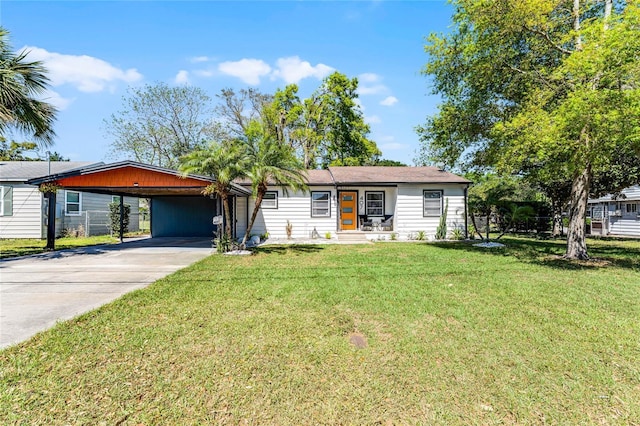 407 E Jersey St, Orlando, FL 32806 - single story home with a carport, concrete driveway, and a front yard