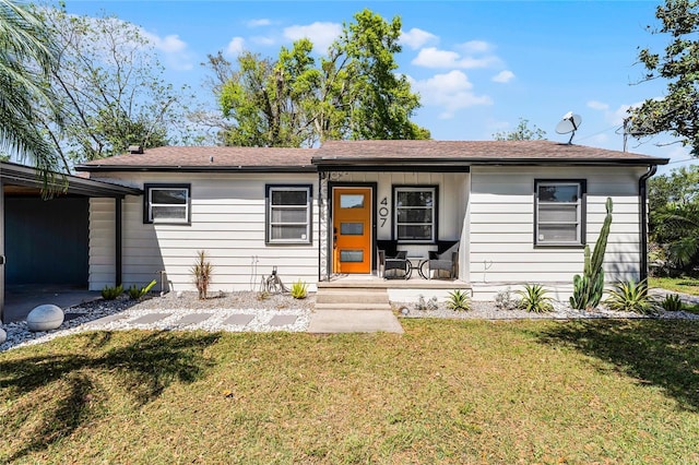 407 E Jersey St, Orlando, FL 32806 - ranch-style home featuring a carport, covered porch, and a front yard