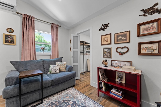 407 E Jersey St, Orlando, FL 32806 - living room featuring baseboards, a wall mounted air conditioner, lofted ceiling, and wood finished floors