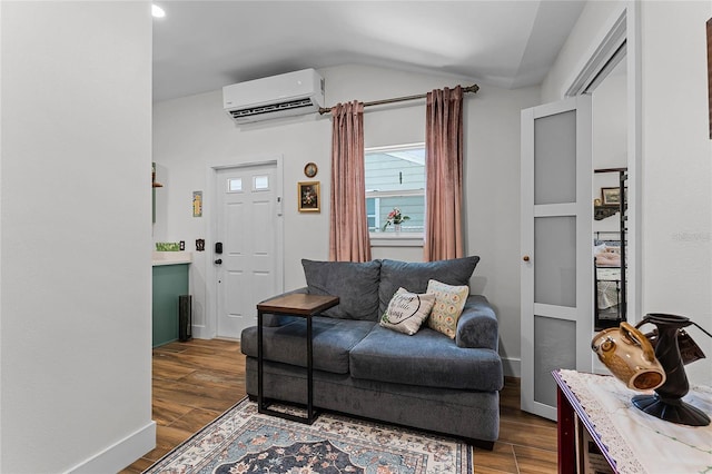 407 E Jersey St, Orlando, FL 32806 - living room with vaulted ceiling, a wall mounted air conditioner, baseboards, and dark wood-style flooring