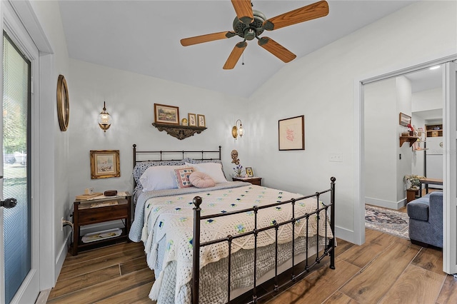 407 E Jersey St, Orlando, FL 32806 - bedroom featuring a ceiling fan, lofted ceiling, baseboards, and wood finished floors
