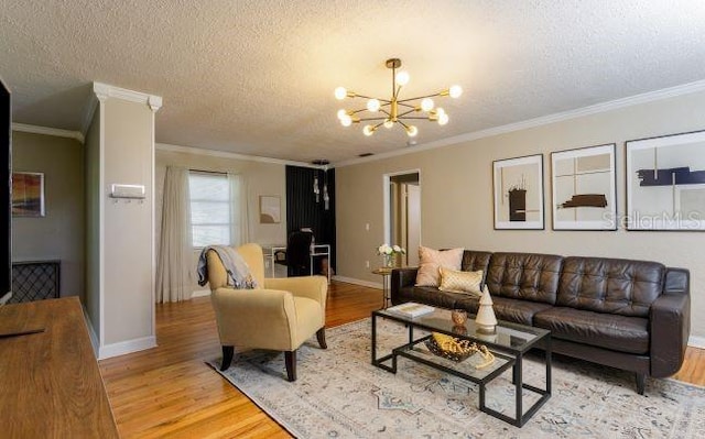 407 E Jersey St, Orlando, FL 32806 - living room with light wood-style floors, a chandelier, and ornamental molding