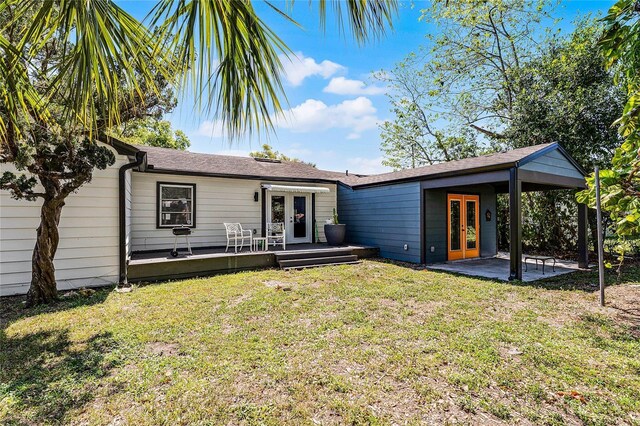 407 E Jersey St, Orlando, FL 32806 - rear view of house with a patio, french doors, a lawn, and a wooden deck