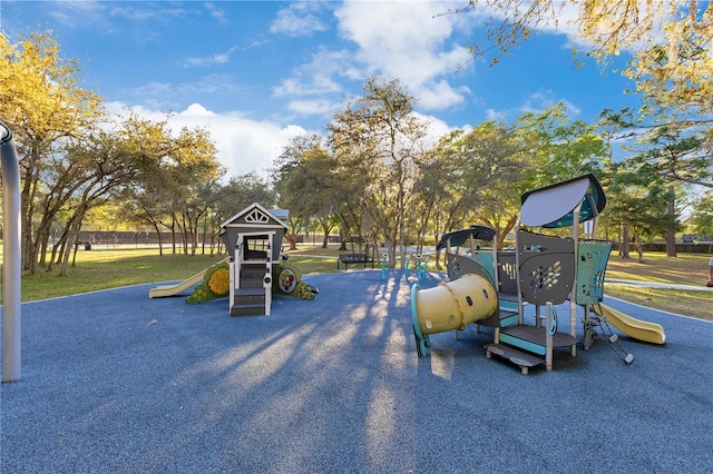 community jungle gym with a lawn