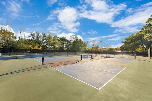 view of sport court featuring community basketball court and fence