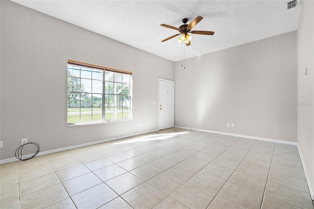 4751 Deer Run Rd, Saint Cloud, FL 34772 - empty room with light tile patterned floors, a ceiling fan, visible vents, and a textured ceiling
