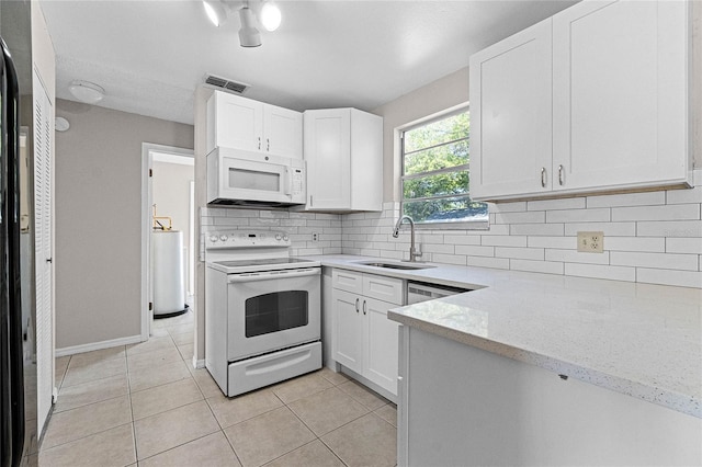 4751 Deer Run Rd, Saint Cloud, FL 34772 - kitchen featuring visible vents, decorative backsplash, light tile patterned flooring, white appliances, and a sink