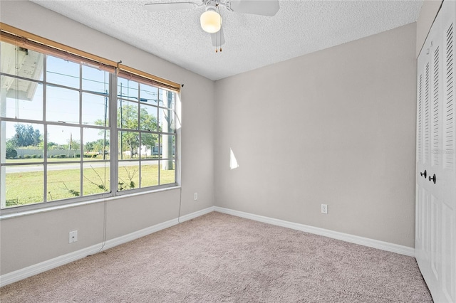 4751 Deer Run Rd, Saint Cloud, FL 34772 - carpeted spare room with a textured ceiling, baseboards, and ceiling fan