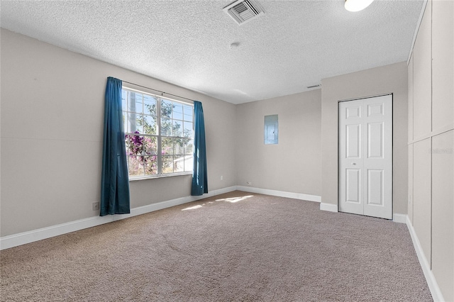 4751 Deer Run Rd, Saint Cloud, FL 34772 - unfurnished bedroom with visible vents, baseboards, carpet floors, electric panel, and a textured ceiling