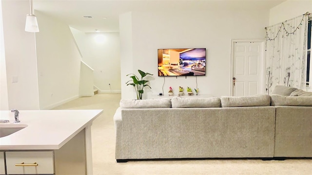 living area with stairway and baseboards