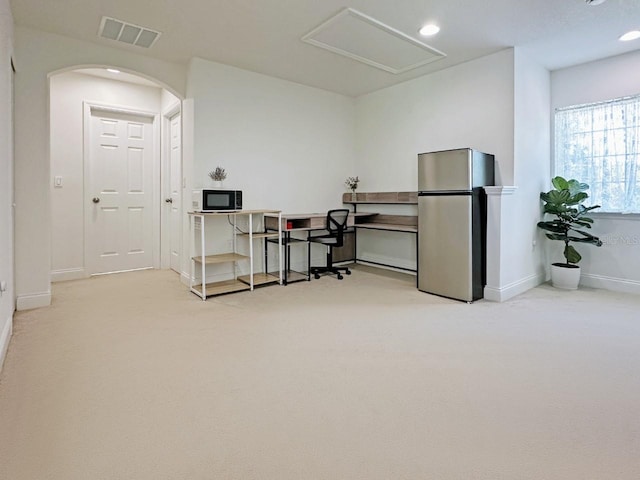 office featuring recessed lighting, visible vents, light carpet, and baseboards
