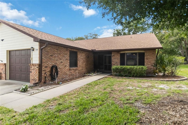 1148 Monroe Ave, Saint Cloud, FL 34769 - single story home featuring a garage, brick siding, a shingled roof, and concrete driveway