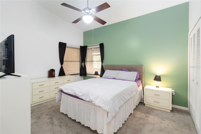 1148 Monroe Ave, Saint Cloud, FL 34769 - bedroom with light carpet, high vaulted ceiling, ceiling fan, and a closet