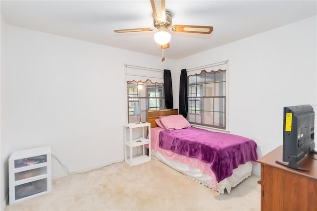 1148 Monroe Ave, Saint Cloud, FL 34769 - carpeted bedroom featuring a ceiling fan and baseboards